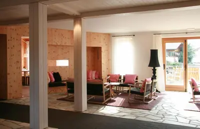 a living room with chairs and a table at Hotel Ploseblick in Naz-Sciaves