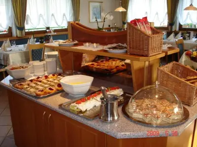 a buffet line with many different types of food at Hotel Ploseblick in Naz-Sciaves
