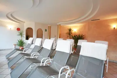 a row of chairs in a waiting room at Hotel Ploseblick in Naz-Sciaves