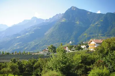 a view of a mountain range with houses and trees at Apartment in Dorf Tirol near Spronser Lakes in Tirolo