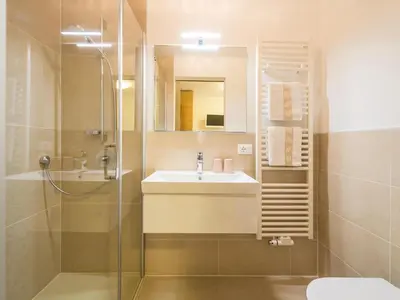 a bathroom with a sink and a shower at Apartment in Dorf Tirol near Spronser Lakes in Tirolo