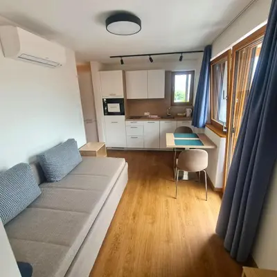 a small living room with a couch and a table at Unterdornerhof in Lagundo
