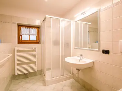 a bedroom with a bed and a window at Apartment Trottner by Interhome in Mazzin