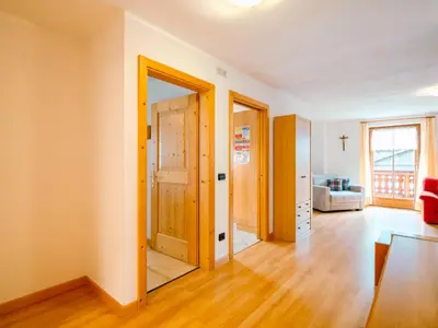 a bathroom with a sink and a toilet and a mirror at Apartment Trottner by Interhome in Mazzin