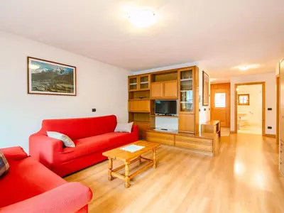 a kitchen and dining room with a table and chairs at Apartment Trottner by Interhome in Mazzin