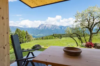 a wooden table with a bowl on top of it at Unterpfaffstall-Hof in Collalbo