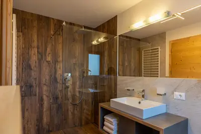 a bathroom with a sink and a shower at Chalet Fisti in La Villa