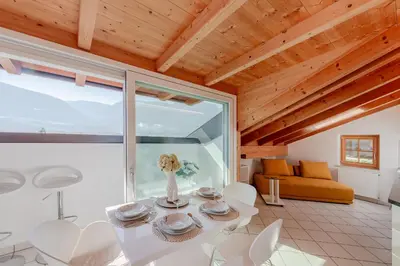 a living room with a white table and chairs at Ferienwohnungen Zwerger Reinhold in Termeno