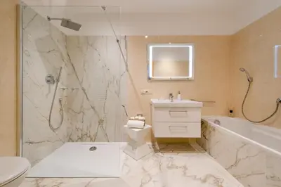 a bathroom with a toilet and a sink and a shower at Ferienwohnungen Zwerger Reinhold in Termeno