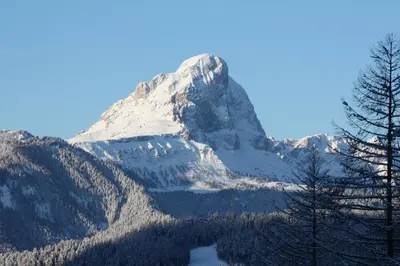 a mountain with a lake in front of it at Le Maier in San Vigilio Di Marebbe