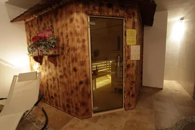 a room with a wooden door in a room at Apartments Salieta in Santa Cristina in Val Gardena