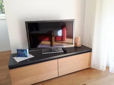 a flat screen tv sitting on top of a dresser at Urbanhof Prantenberger in Bolzano