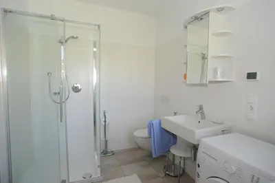 a bathroom with a shower and a toilet and a sink at Urbanhof Prantenberger in Bolzano
