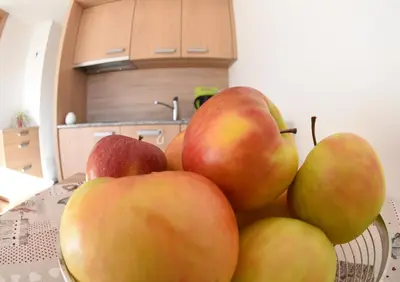 a pile of apples sitting on a counter in a kitchen at Urbanhof Prantenberger in Bolzano
