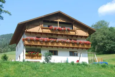 a house with flower boxes on the side of it at Apartments Dolomites 