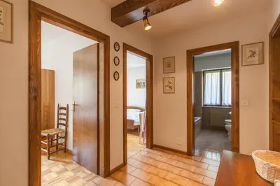 a hallway with a door leading to a room at Casa Elena in Canale dʼAgordo