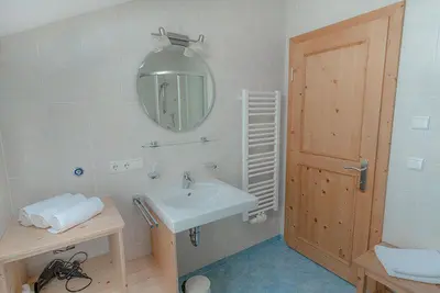 a white bathroom with a sink and a mirror at Gönnerhof in Perca