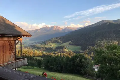 a view of a valley with mountains and a building at Gönnerhof in Perca