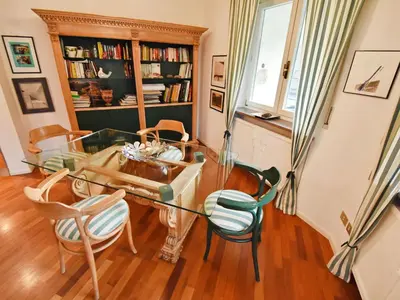 a fireplace with a wooden mantel on top of it at Apartment Villa Esperia by Interhome in Merano