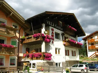 a model of a house with a park in the yard at Garnì Villa Cecilia in Mazzin
