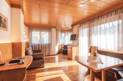 a living room with a couch and a table at Garni Residence Trocker in Castelrotto