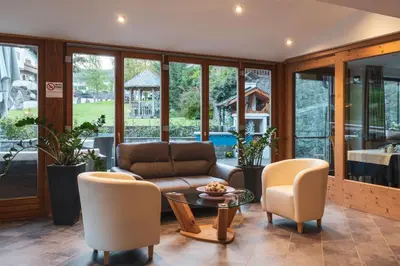 a living room with a couch and chairs and a table at Garni Residence Trocker in Castelrotto