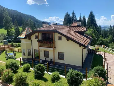 a small house with a balcony on a hill at Obereggen - Anna in Eggen
