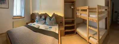 a bedroom with two bunk beds in a room at Obereggen - Anna in Eggen