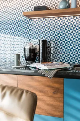 a counter in a kitchen with blue and white tiles at ANTON Dolomites Hideaway in Brunico