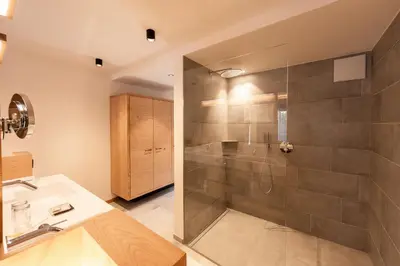 a bathroom with a shower and a sink at Hotel Rierhof in Chiusa