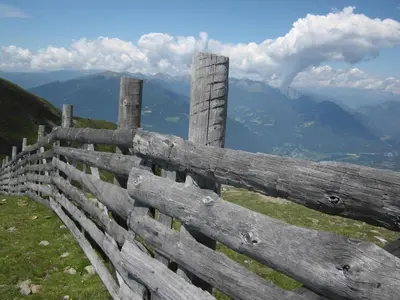 a wooden fence on top of a mountain at Panorama Residence Schlossblick in Rodengo