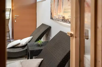 two chairs and a table with a plant on them at Panorama Residence Schlossblick in Rodengo