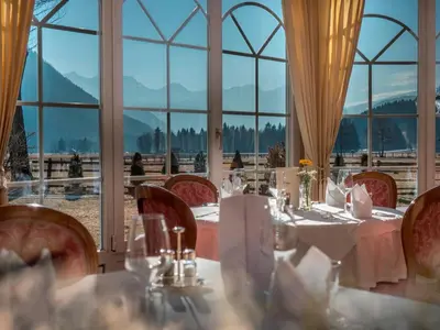 a bedroom with a bed with a table on it at Hotel Bad Salomonsbrunn in Anterselva di Mezzo