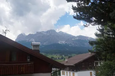 a view of a mountain range from a house at FALORIA Studio Apartment in Cortina dʼAmpezzo