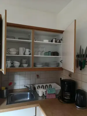 a kitchen with a sink and a counter with dishes at Apartment Furschermuehle in Siusi