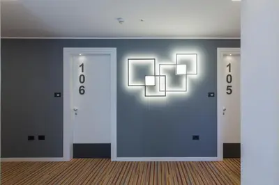 a room with two doors with numbers on them at Tourist Hotel in Bressanone