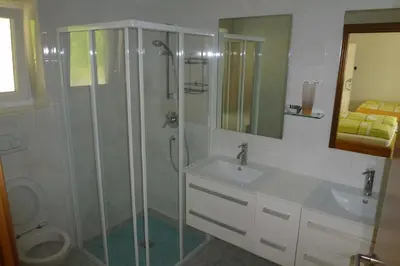 a bathroom with a shower and a sink at Zum Schwarzen Kus in Caldaro