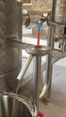 a red and blue toothbrush sitting on a metal stand at Obergereuth Hof 1288 in San Martino