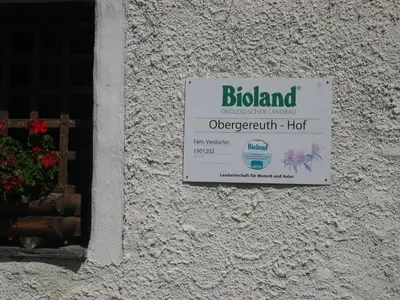 a sign on the side of a building at Obergereuth Hof 1288 in San Martino