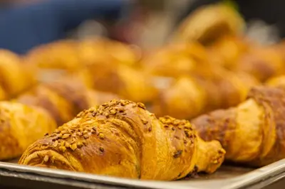 a bunch of pastries sitting on a tray at Hotel Lago di Braies in Braies