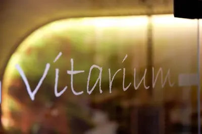 a sign that says vignulum written on a window at Hotel Costes in Corvara in Badia