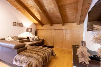 a living room with a couch and a table at Ferienhaus Winkler in Anterivo