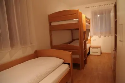 a small room with a bunk bed and a bunk bedouble at El Paradiso in Naturno