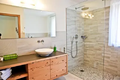 a bathroom with a sink and a shower at El Paradiso in Naturno