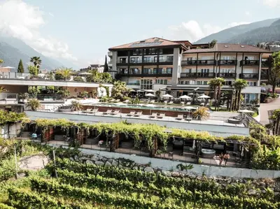 a hotel with plants on the side of it at Boutique Hotel Eschenlohe Adults only in Schenna