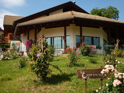 a house with a sign in front of it at La Capannina in Coredo