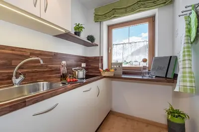 a kitchen with a sink and a window at Living Puez in Funes