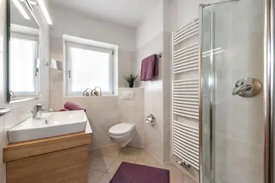 a bathroom with a sink toilet and a shower at Living Puez in Funes