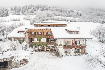 a house with snow on the roof at Haus Tirol in Molini di Tures