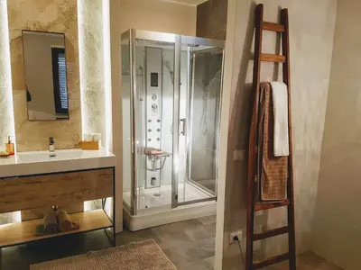 a bathroom with a shower and a sink at Your secret place to stay - Therme Meran in Merano